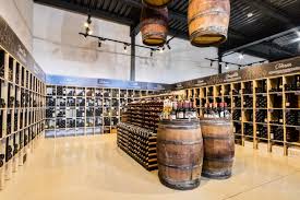 The Empty Storage Hall Space Required Extensive Technological And Structural Changes We Inserted A Steel Galle Wine Store Design Wine Shop Interior Wine Store
