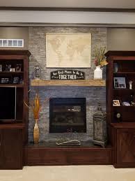 These barnwood barn beam fireplace mantels are made from solid reclaimed pine barn beams, that were reclaimed from a 100+ year old barn in se mn. Wood Storiedboards Reclaimed Wood Fireplace Mantel 59 Inch Rustic Hand Hewn Raw Materials