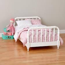 Some parents transition their babies as early as 18 months, but the average age tends to be around 3 or 3.5. You Might Be Thinking About Moving Your Tot Up Into A Big Kid Bed Now They Have Turned 2 While This Is A Common Ag Jenny Lind Toddler Bed Toddler Bed Kid