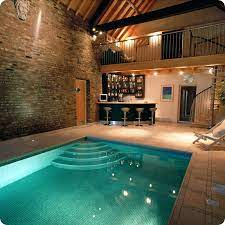 When most people think of swimming pool designs, particularly at someone's home, indoor pools probably aren't the first thing that pop into their heads.after all, when it comes to residential properties, outdoor swimming pool designs are much more common. Indoor Swimming Pool Designs Home Designing Indoor Swimming Pool Design Indoor Pool House Indoor Pool Design