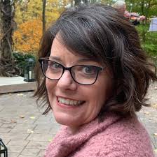 Do you rinse dahlia tubers with plain water or a bleach mix?