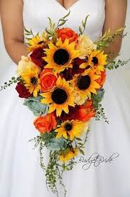 Roses, carnations, hydrangeas, peonies, greenery, orhids, lilies Cascading Wedding Flower Brides Bouquet With Sunflowers Orange And Dark Red Roses With Gre Red Bouquet Wedding Sunflower Themed Wedding Wedding Flowers Summer