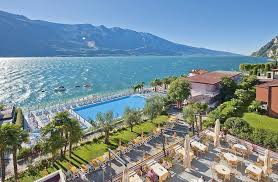 Beds done up in simple white bedding rest on modern frames backed by padded headboards in light gray. Hotel Ideal Prices Reviews Limone Sul Garda Lake Garda Italy Tripadvisor