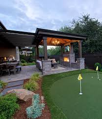 Retractable patio doors lead to an amazing transitional/rustic covered porch. No Better Way To Live Http Www Paradiserestored Com Landscaping Blog Enjoying Life Relaxing Little Golf Side Playin Patio Deck Designs Patio Backyard