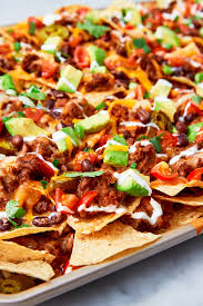 Treat Yourself To These Decadent Nachos Supreme Recipe Nachos Supreme Recipe Appetizer Recipes Nachos Supreme