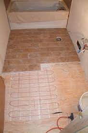 It's a nice, affordable choice of materials that grounds the large space. Heated Travertine Floor Floor Heating Systems Flooring Bathroom Flooring