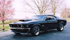 John wick je zabiják na odpočinku, přesně ten typ chlápka, kterému je lepší se vyhnout. Mustang Boss Muscle Cars Mustang