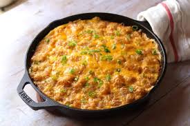 Stir in the chicken or turkey and then sprinkle the flour over the top and stir it until it's all combined with the turkey and vegetables. Denver Omelet Tater Tot Casserole Recipe The Hungry Hutch