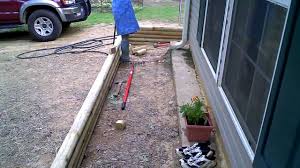 Every subsequent row should be pitched into the slope by 1/4 inch from the row below it. Landscape Timber Installation Progress Part 1 Youtube
