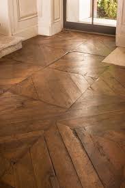 European Puzzle Putting Together This Floor Was Like Working On A Jigsaw Puzzle With Mismatched Pieces Wheth Hardwood Floors Rustic Hardwood Floors Hardwood