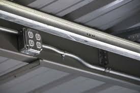 Slide the studs into channels at. Steel Building Electrical Conduit Lighting Installation