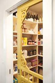 Vintage kitchen, white marble countertops. Vintage Pantry With Yellow Door Vintage Kitchen