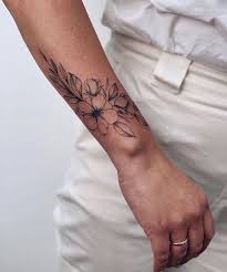Wrist tattoos and designs that will get you excited to get your own. Tattooedgirls Wrap Around Wrist Tattoos Wrist Tattoos Tattoos For Women Flowers