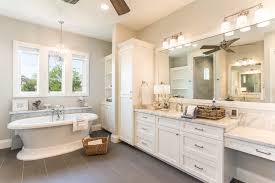 The soft grays in the room, reminiscent of a weathered barn, are brightened by creamy white walls and splashes of sunny yellow. Low Country Southern Style Home Farmhouse Bathroom Houston By Jancy Ervin Interiors Houzz