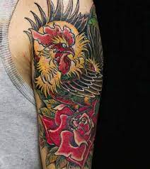 In the chinese zodiac calendar, those who are born under the year of the rooster are seen as confident. Rooster Tattoo For Men With Rose In Traditional Style Upper Arm Rooster Tattoo Tattoo Designs Men Tattoos
