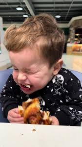 Little Asian Boy Telling Dad What He Wants to Eat