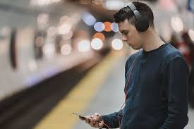 Kelsey mckinney is a culture staff writer for fusion. Hd Wallpaper Person Listening To Music While Holding Phone Train Station Wallpaper Flare