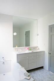 Amazing Bathroom Features Ceiling Height Frameless Mirror Over Vanity Topped With Polished Car Architecture Bathroom Grey Interior Doors Bathroom Inspiration