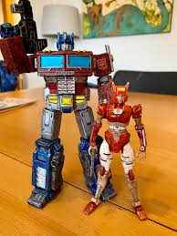 Custom painted ER Optimus and Elita-One. Roll Out! : r/transformers