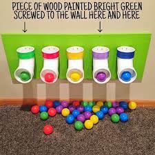 Diy Ball Drop I Still Get A Lot Of Questions About This Ball Drop We Made For Our Basement Playroom So Hope Ball Drop Diy Montessori Toys Toddler Playroom