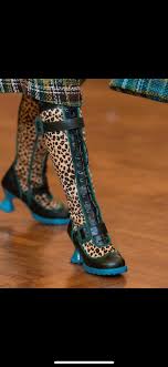 Wearing my Fluenicorns today. It was difficult to get a good photo today.  The tights are purple/black stripes from SNAG. Thanks to Janice Mapes  Stafford for her fashion photography skills