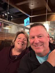 Some of St. Joan of Arc Welcome the Stranger members dining out at  immigrant owned businesses to show support.