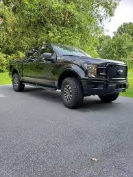 These aftermarket raptor wheels & tires will add some sleek styling to your rugged pickup and cause a few more double takes from the masses on the roadway and the trail! Side Pic Of The Level And Raptor Wheels F150