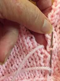 Then you bind off the knitted project and sew a piece of fabric inside of the knitted purse 4 inches. How To Knit The Mattress Stitch To Connect Two Knitted Pieces Needlepointers Com Mattress Stitch Knitting Knitting Tutorial Mattress Stitch