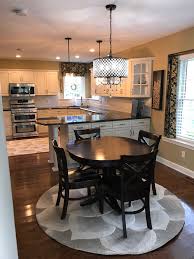 Love The Round Dining Table Corner Sink And Long Counter Tops Home Kitchens Classic White Kitchen Kitchen Design Small