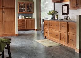 Wooden Kitchen Cabinets And Gray Quartz Countertops Laminate Flooring In Kitchen Laminate Tile Flooring Kitchen Flooring