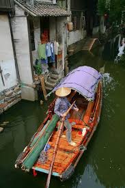 Rowing A Little Boat On Zhouzhuang Channels China Travel China Shanghai China