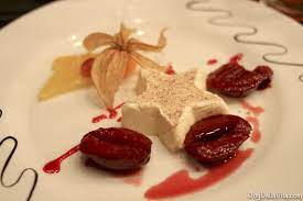 cinnamon panna cotta with portwein plums restaurant falkenburg stgallen travelblog joydellavita plum restaurant food restaurant