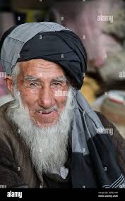 An Afghan elder sits outside his store at the Anaba Bazaar in the Panjshir  Province, Afghanistan