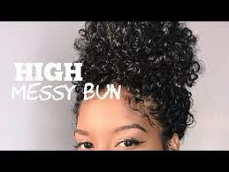 While Some Women Love To Embrace Their Shrinkage Some Prefer A Stretched Out Look To Sh Curly Hair Bun Styles Curly Hair Styles Naturally Messy Bun Curly Hair