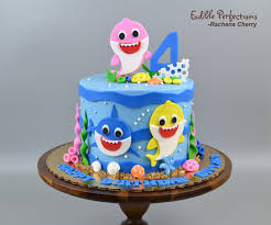 Baby shark cake start by stacking four cakes with frosting between each layer. Baby Shark Cake Edible Perfections