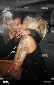 Jodie Marsh and her girlfriend Nina kiss in the back of a taxi after  leaving Chinawhite nightclub London, England 