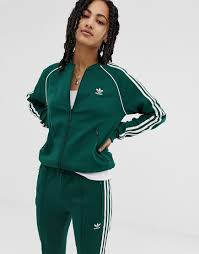 Black And Gold Adidas Jacket Womens Adidas Originals Jackets Adicolor Three Stripe Track Jacket In Green Green Adidas Origin In 2020 Adidas Tracksuit Women Adidas Jacket Women Adidas Originals Outfit