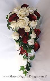The handle is wrapped in a dusty satin and artificial pears to day one to remember. Real Touch Flowers Natural Touch Flowers True Touch Flowers Wedding Flowers Sharon Na White Roses Wedding Wedding Bridal Bouquets Cascading Wedding Bouquets