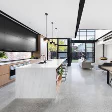 Grey Polished Concrete Floor With Black And White Aggregate Black Framed Windows Black And Woo Modern Kitchen Design Interior Design Kitchen Concrete Kitchen