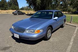 Image result for Portofino Blue 1995 Town Car