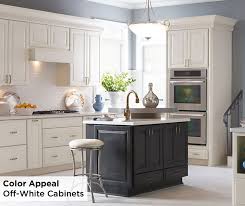 While White Kitchens May Be A Fan Favorite These Off White Diamond Maple Sullivan Cabinets W Off White Kitchens Off White Kitchen Cabinets Grey Kitchen Island