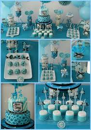 A boy's baby shower dessert table decorated in turquoise, with turquoise cubes and a funny teddy bear. Party Ideas Baby Shower Candy Baby Shower Cakes For Boys Baby Shower Decorations For Boys