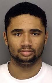 1 held, 2 sought in car fire killings