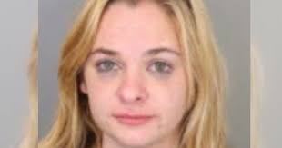 Woman allegedly hit, bit police officer