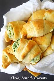 These Cheesy Spinach Crescents Are An Easy Snack To Serve For Holidays Light Fluffy Crescent Rolls Loaded Wit Crescent Recipes Recipes Crescent Roll Recipes