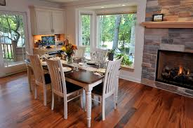 While people are getting more and more adventurous with mixing periods and styles in their home, one of the puzzling questions we're always asked as editors is how to mix wood tones in a room.whether it's matching a dining table to an existing hardwood floor or trying to mix various wood furniture pieces together, many people are hesitant to combine different woods in a space. A View Of The Dining Room Table White Walls Contrast Against The Brazilian Cherry Hardwood Floori Wood Table Decor Cherry Hardwood Flooring Cherry Wood Floors