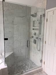 Marble Shower With Hexagon Floor And Frameless Shower Door Frameless Shower Doors Shower Doors Bathroom Remodel Shower