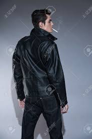 We did not find results for: Retro Rock And Roll 50s Fashion Man With Dark Grease Hair Smoking Cigarette Wearing Black Leather Jacket Studio Shot Against Grey Stock Photo Picture And Royalty Free Image Image 25226980