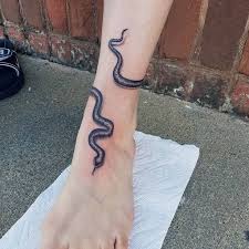 This can be rendered with the help of other props like a basket and a pair of dice. Snake Tattoo Leg Wrap Novocom Top