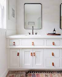 Vanity unit is a piece of bathroom furniture that consists of a washbasin on top and storage cupboards beneath it. Leather Straps Are Our Favorite Cheap Bathroom Accessories Domino Diy Bathroom Design Cheap Bathroom Accessories Bathroom Accessories Luxury